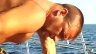 Muscled hunks fuck on a boat
